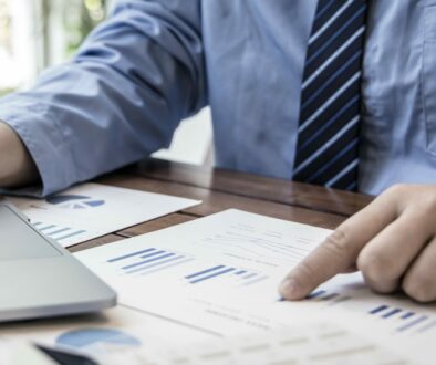 Financial businessmen use laptop to analyze marketing strategies